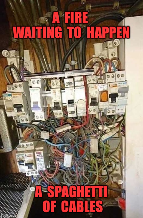 A accident waiting to happen | A  FIRE  WAITING  TO  HAPPEN; A  SPAGHETTI  OF  CABLES | image tagged in spaghetti junction,major hazard,electrical danger,one job | made w/ Imgflip meme maker