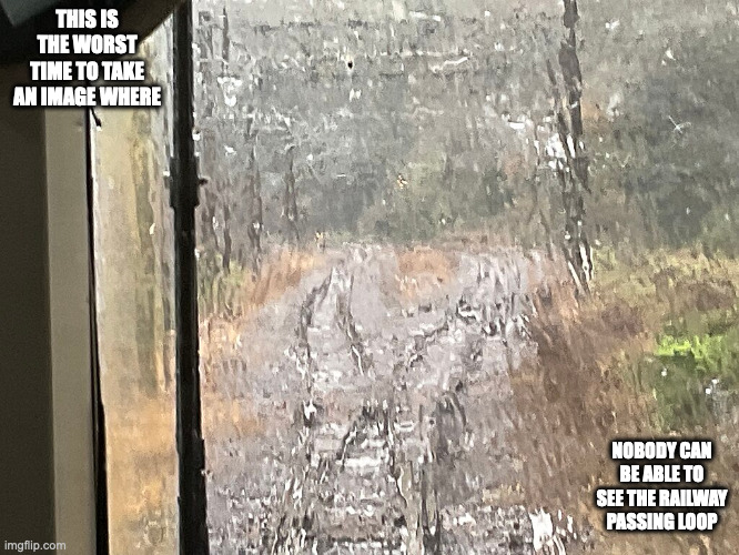 Kirishima Passing Loop During a Shower | THIS IS THE WORST TIME TO TAKE AN IMAGE WHERE; NOBODY CAN BE ABLE TO SEE THE RAILWAY PASSING LOOP | image tagged in rain,trains,memes | made w/ Imgflip meme maker