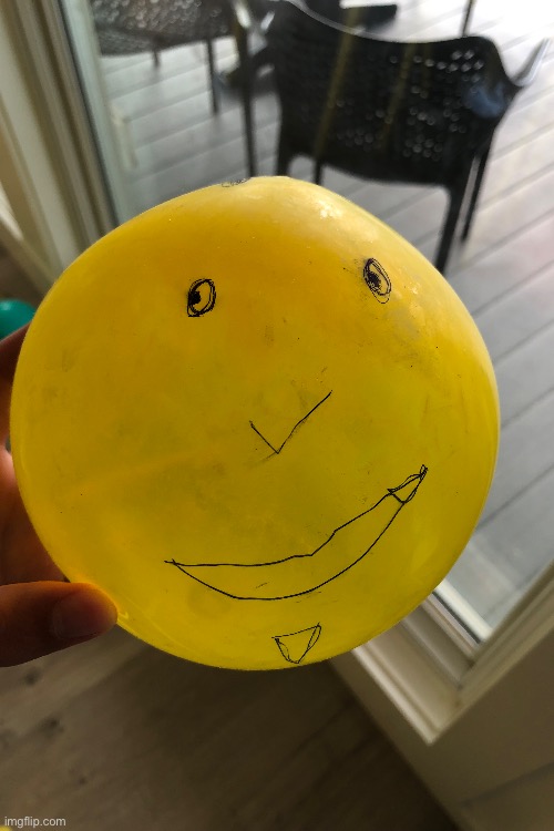 A balloon my cousin drew on | image tagged in balloon,yellow,goofy,cousin | made w/ Imgflip meme maker