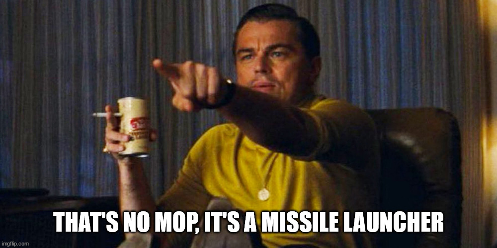 Leo pointing | THAT'S NO MOP, IT'S A MISSILE LAUNCHER | image tagged in leo pointing | made w/ Imgflip meme maker