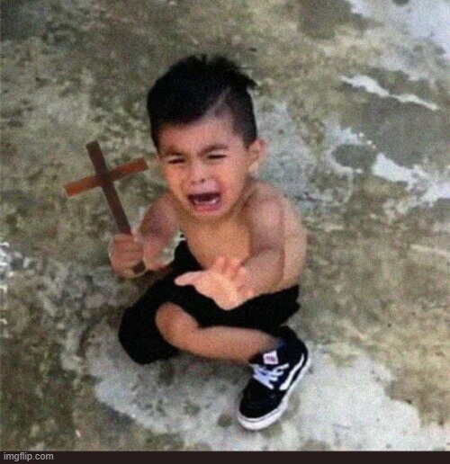 Scared kid with cross | image tagged in scared kid with cross | made w/ Imgflip meme maker