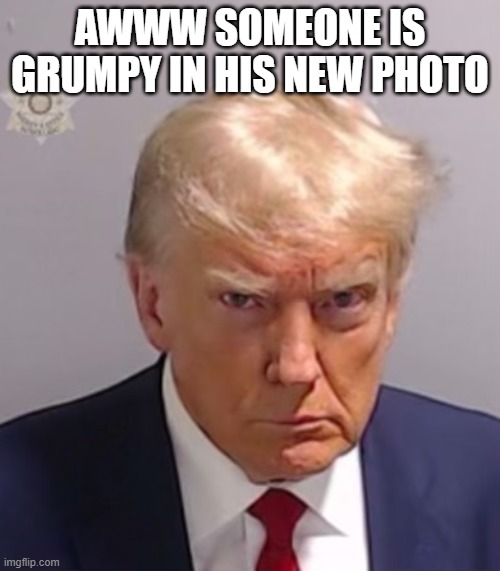 Donald Trump Mugshot | AWWW SOMEONE IS GRUMPY IN HIS NEW PHOTO | image tagged in donald trump mugshot | made w/ Imgflip meme maker