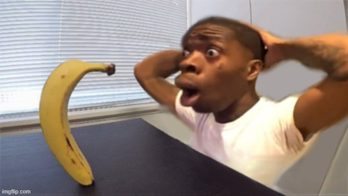 Shocked black guy staring into a banana | image tagged in shocked black guy staring into a banana | made w/ Imgflip meme maker
