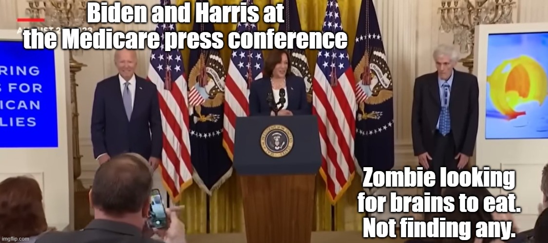 Biden Zombie | Biden and Harris at the Medicare press conference; Zombie looking for brains to eat.
Not finding any. | made w/ Imgflip meme maker