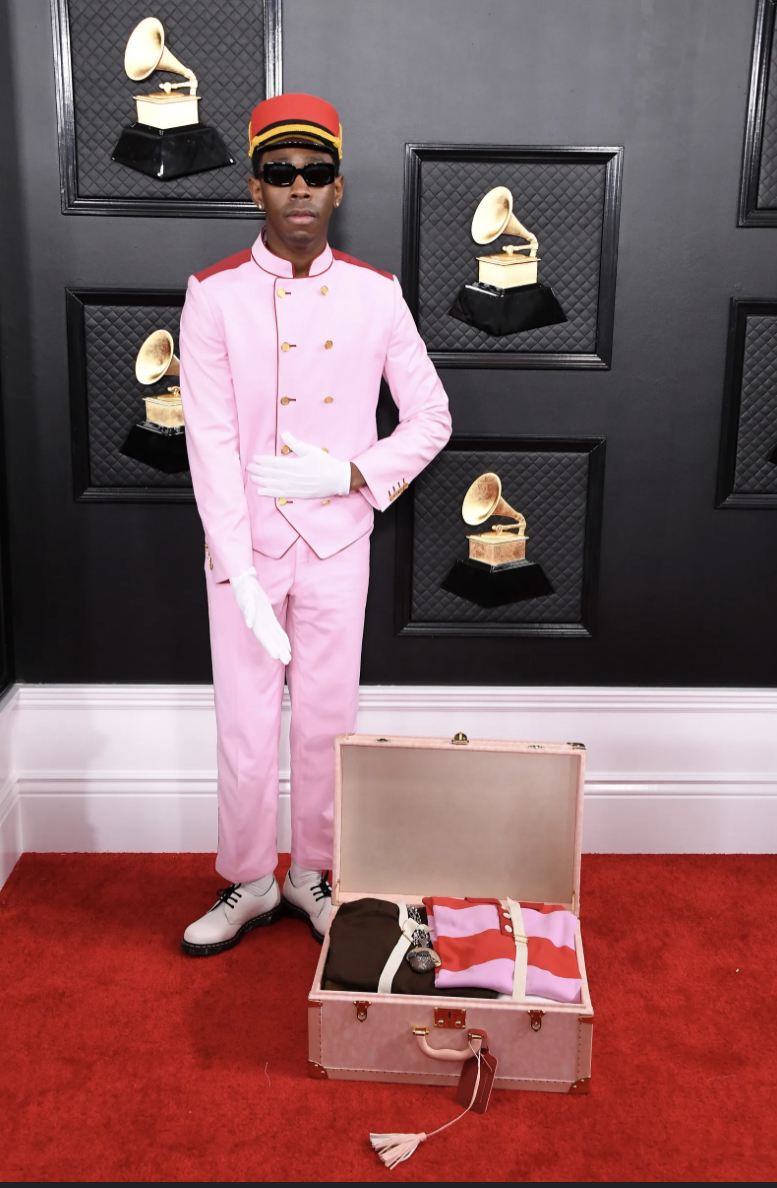 High Quality Tyler the Creator presenting luggage Blank Meme Template