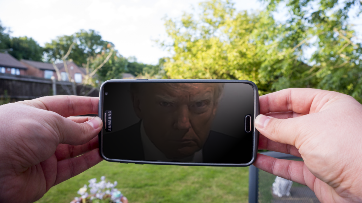 Trump looking at phone Blank Meme Template