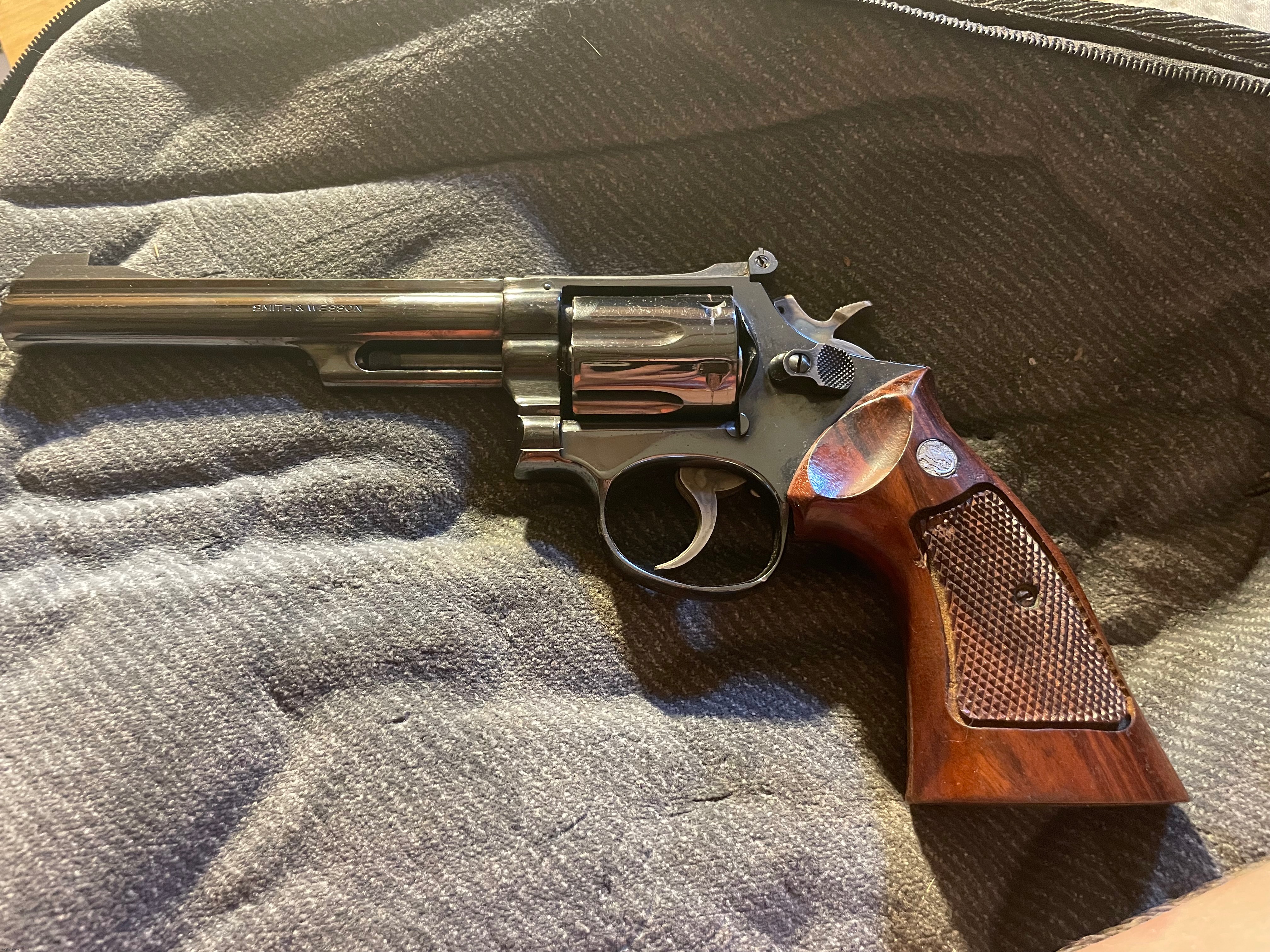 My dads old Smith & Wesson revolver | image tagged in guns,photography,photos | made w/ Imgflip meme maker
