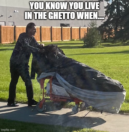 Funny homeless man carries his possesions. | YOU KNOW YOU LIVE IN THE GHETTO WHEN.... | image tagged in comedy,funny,homeless,shopping cart | made w/ Imgflip meme maker