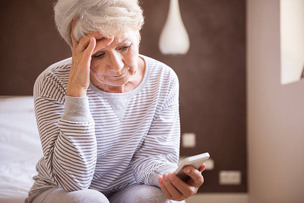 OLDER WOMAN SAD LOOKS AT PHONE Blank Meme Template