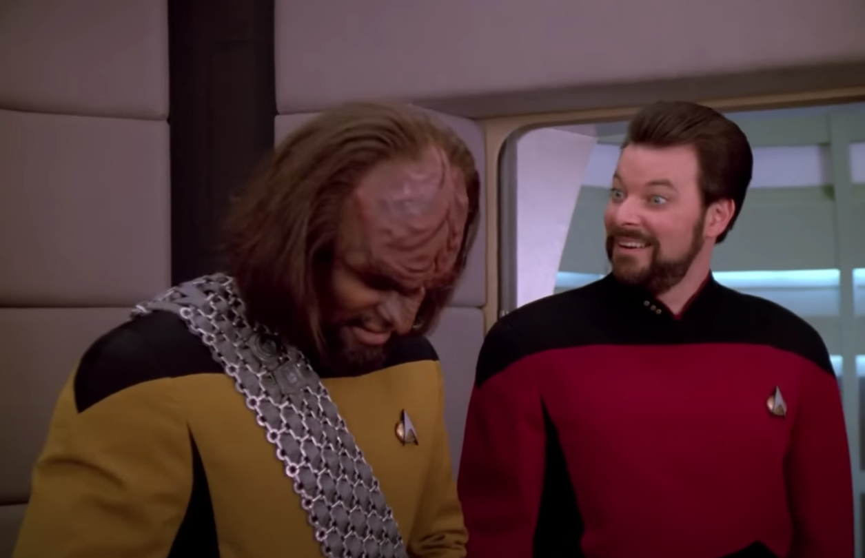 Riker Smiling Weirdly At Worf By Turbolift Blank Meme Template