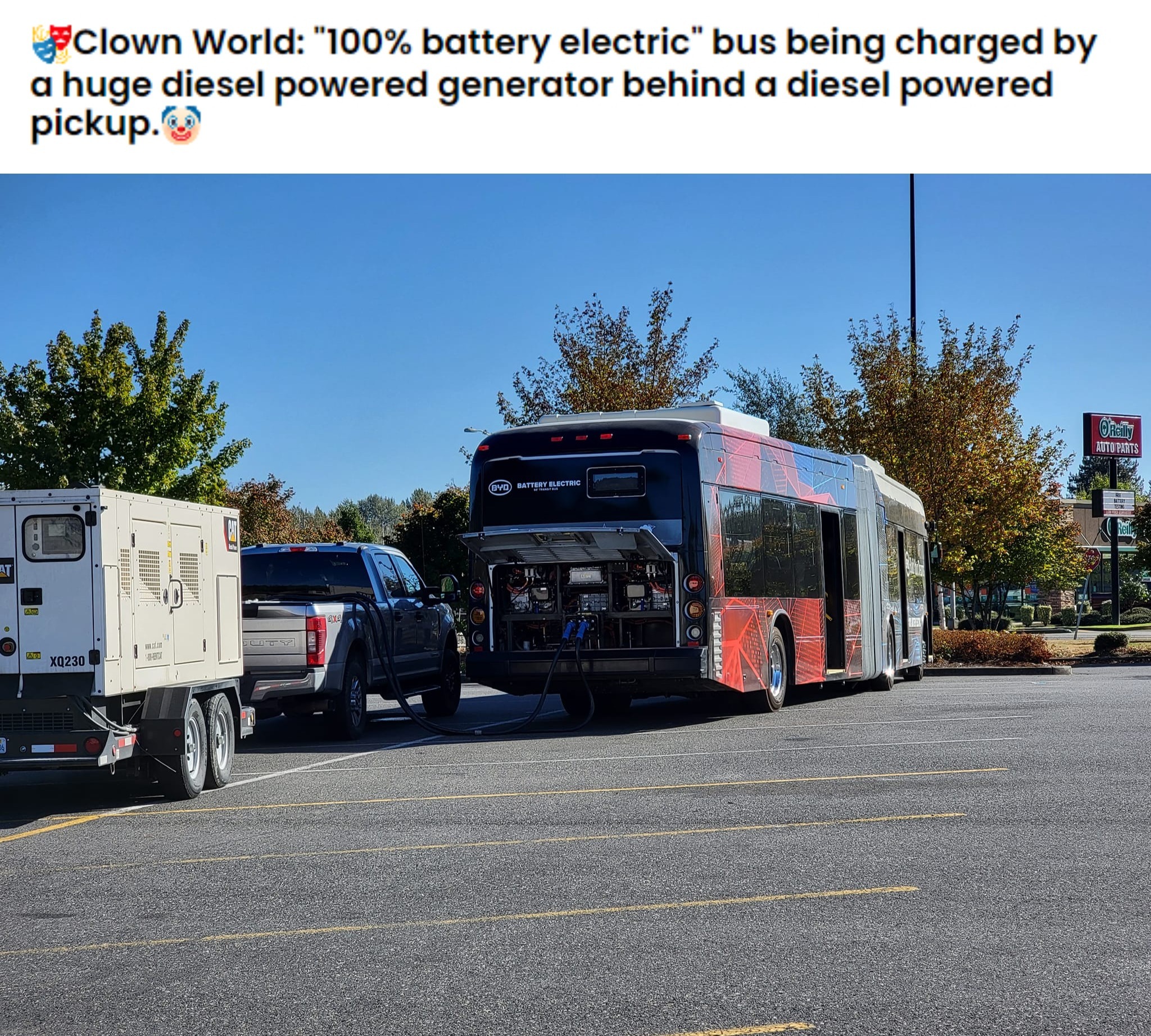 Clown World: "100% battery electric" bus being charged by a huge diesel powered generator... | image tagged in clown world,elon musk,epic fail,electric vehicles,never go full retard,carbon footprint | made w/ Imgflip meme maker