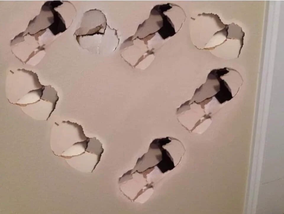 Wall punches shaped into a heart Blank Meme Template