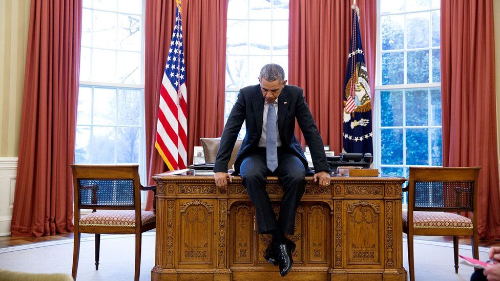 Obama sitting on desk Blank Meme Template