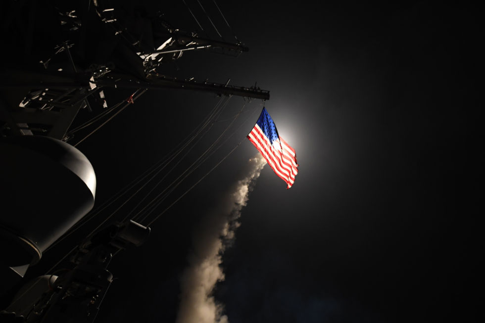 American ship launches cruise missile at night behind US flag Blank Meme Template