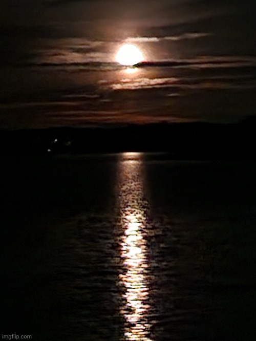 The moon looks like a sunset | image tagged in moon,water | made w/ Imgflip meme maker