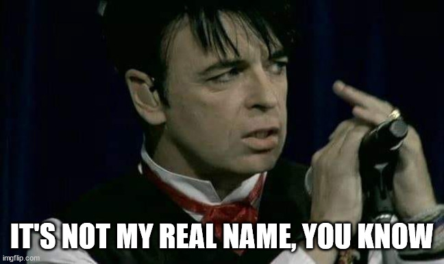 gary numan red ascot | IT'S NOT MY REAL NAME, YOU KNOW | image tagged in gary numan red ascot | made w/ Imgflip meme maker