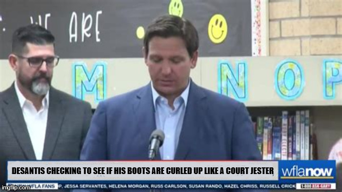 Curly toes DeSantis | DESANTIS CHECKING TO SEE IF HIS BOOTS ARE CURLED UP LIKE A COURT JESTER | image tagged in ron desantis,shoe lifts,florida,fascist,candidtate for president,sounds gay | made w/ Imgflip meme maker
