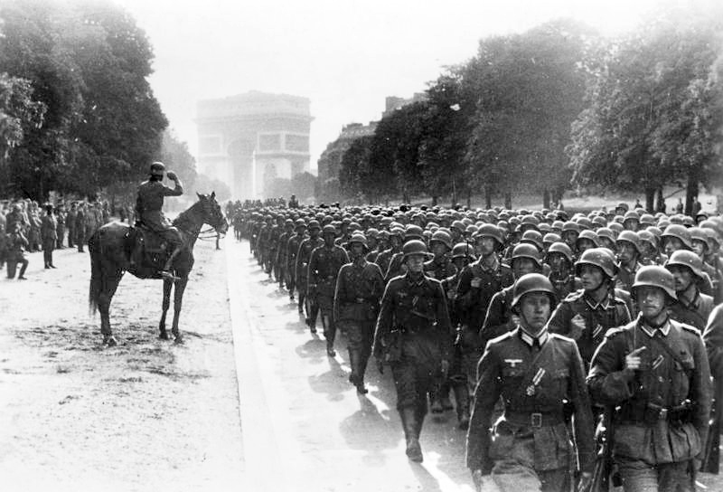 German soldiers march near the Arc de Triomphe in Paris Blank Meme Template