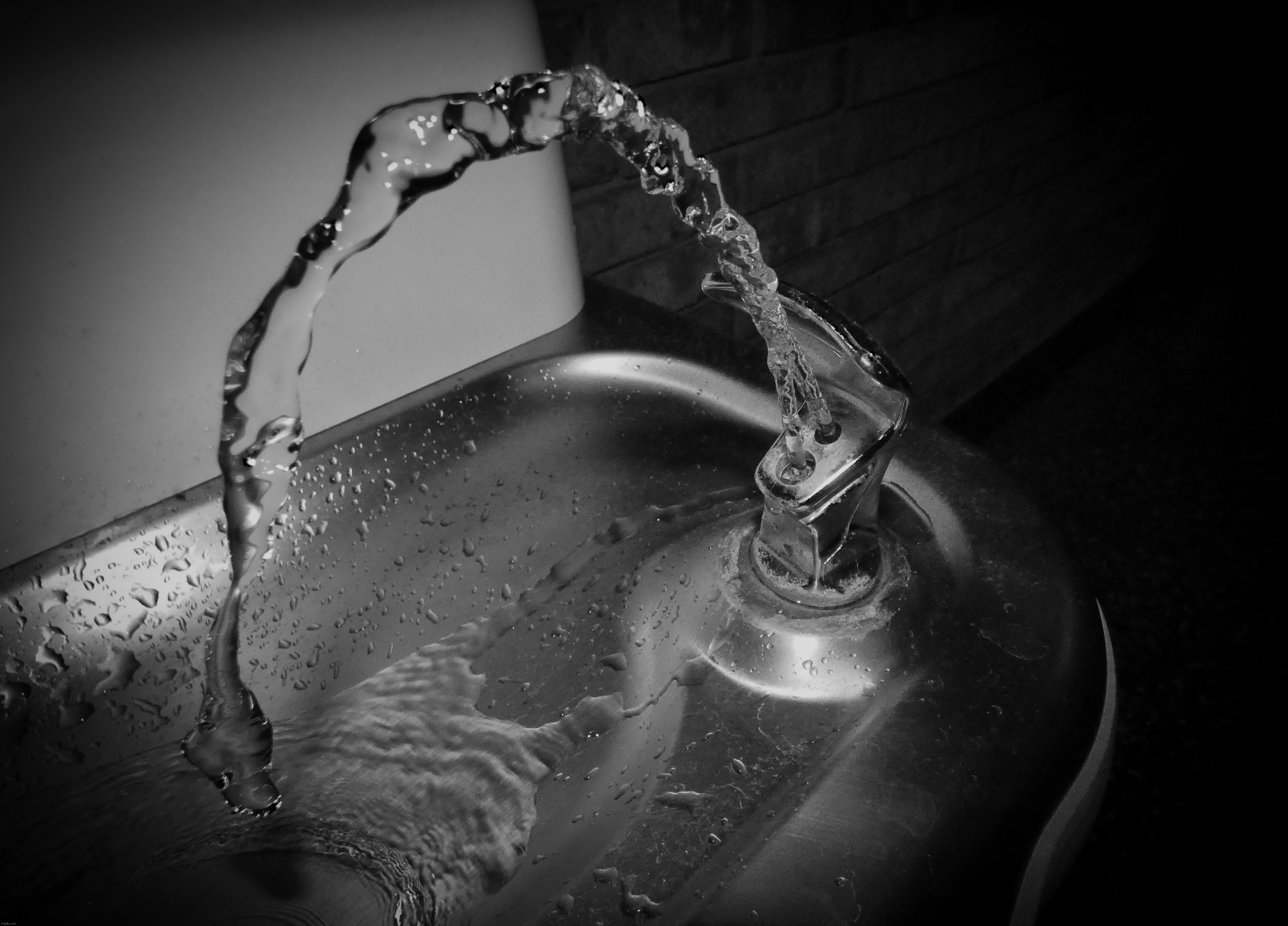 An example of fast shutter speed portrayed by a school water fountain | image tagged in share your own photos,photography | made w/ Imgflip meme maker