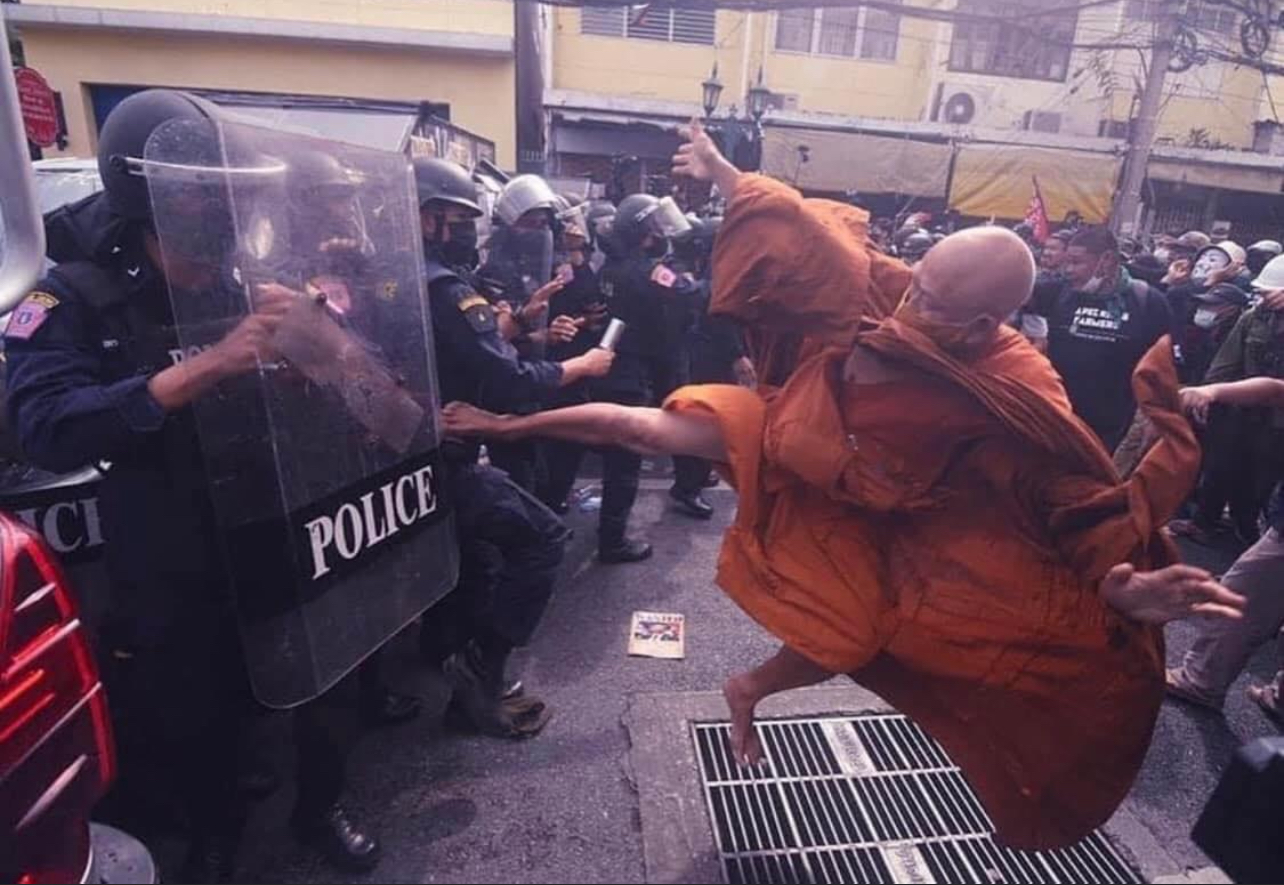 Monk kicking riot police Blank Meme Template