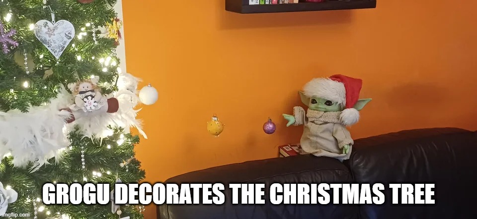 Merry Grogu | GROGU DECORATES THE CHRISTMAS TREE | image tagged in star wars,grogu | made w/ Imgflip meme maker
