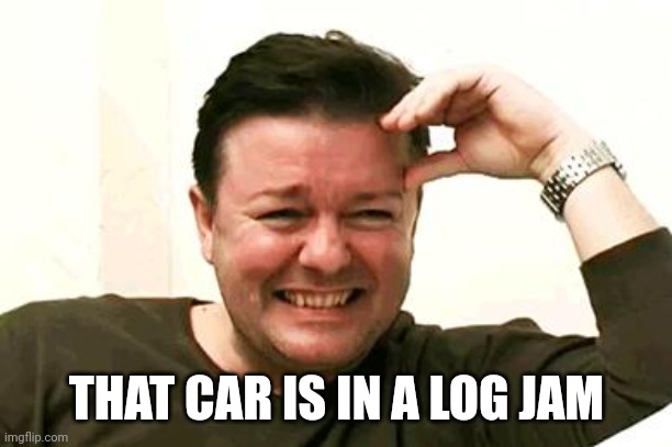 Laughing Ricky Gervais | THAT CAR IS IN A LOG JAM | image tagged in laughing ricky gervais | made w/ Imgflip meme maker