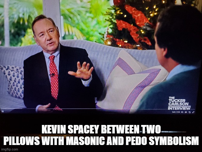 Kevin Spacey and Tucker Carlson discuss presidency | KEVIN SPACEY BETWEEN TWO PILLOWS WITH MASONIC AND PEDO SYMBOLISM | image tagged in kevin spacey,tucker carlson,presidency,staged pillows | made w/ Imgflip meme maker