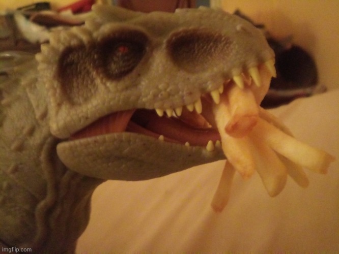 Indominus Rex eating french fries from McDonald's | image tagged in jurassic park,jurassic world | made w/ Imgflip meme maker