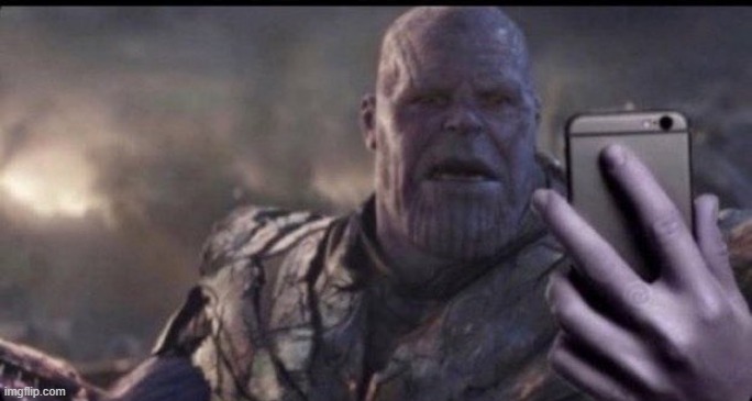 thanos holds phone | image tagged in thanos holds phone | made w/ Imgflip meme maker