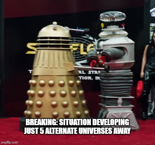Robot fight! | BREAKING: SITUATION DEVELOPING JUST 5 ALTERNATE UNIVERSES AWAY | image tagged in dalek,robot,lost in space | made w/ Imgflip meme maker