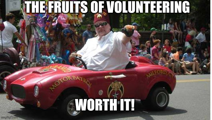 Shriner volunteer rocks the parade | THE FRUITS OF VOLUNTEERING; WORTH IT! | image tagged in shriner,float,parade,rocking it,memes,volunteers | made w/ Imgflip meme maker