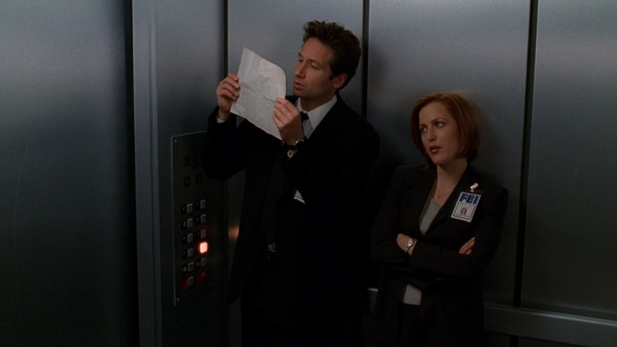 High Quality Mulder and Scully Elevator Looking At Paper Blank Meme Template