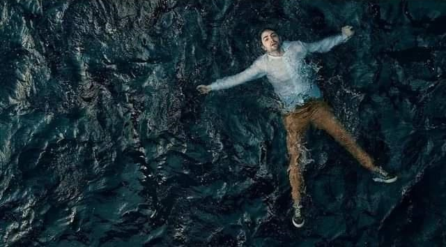 MAN FLOATING IN THE OCEAN Blank Meme Template