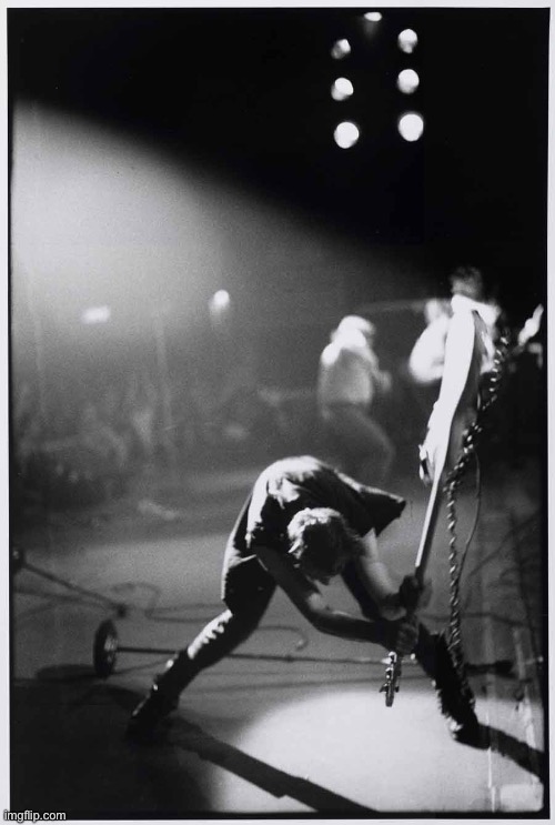 Paul Simonon smashing his guitar | image tagged in paul simonon smashing his guitar | made w/ Imgflip meme maker