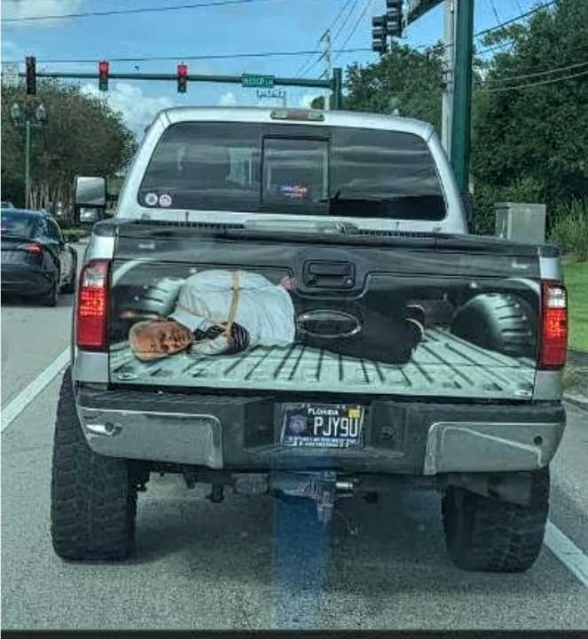 High Quality Joe Biden hogtied for execution in pickup truck Blank Meme Template