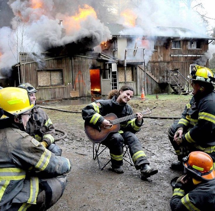 High Quality Firefighters play guitar against a background of fire Blank Meme Template