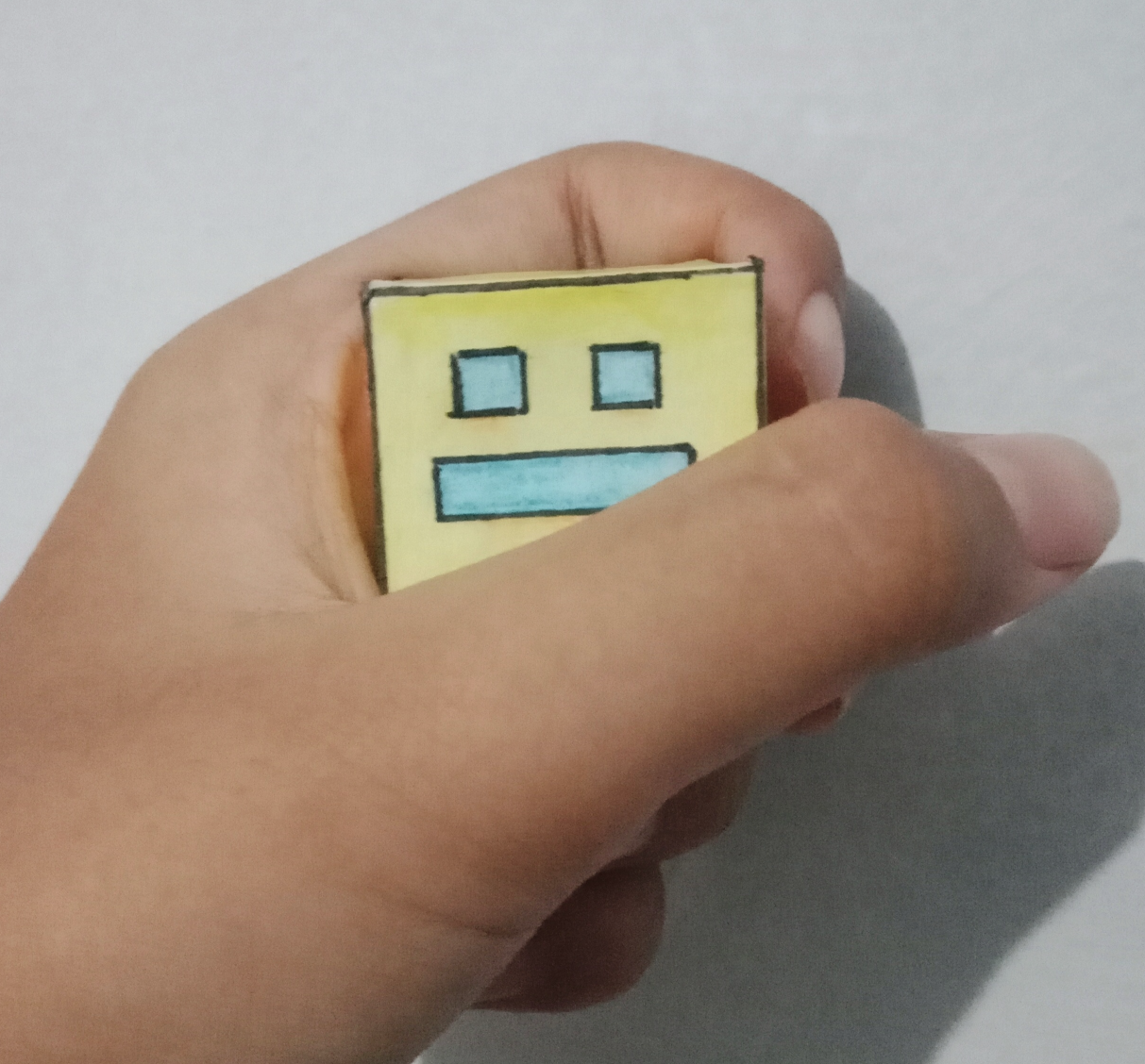 High Quality Geometry Dash paper cube being held Blank Meme Template