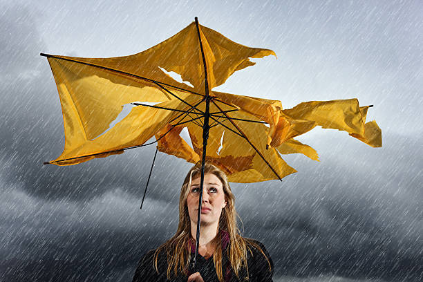 High Quality a person holding a broken umbrella in the rain Blank Meme Template