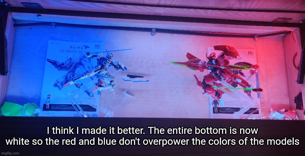 It doesn't show well on camera because of course it doesn't but I like how it turned out | I think I made it better. The entire bottom is now white so the red and blue don't overpower the colors of the models | made w/ Imgflip meme maker