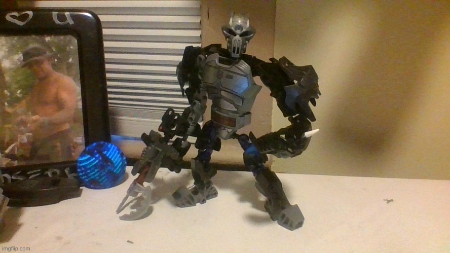 This is Superior Bounty Hunter Klax. (my dads picture is in the frame do not mind him) | made w/ Imgflip meme maker