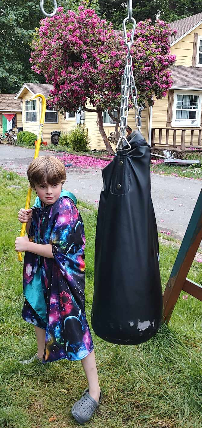 High Quality kid holding a crowbar about to hit a Punching Bag Blank Meme Template
