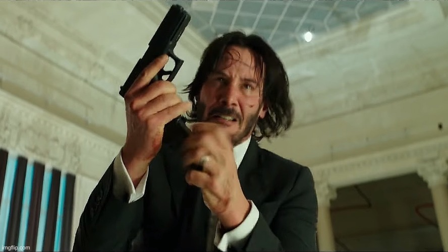 John Wick Reloading | image tagged in john wick reloading | made w/ Imgflip meme maker