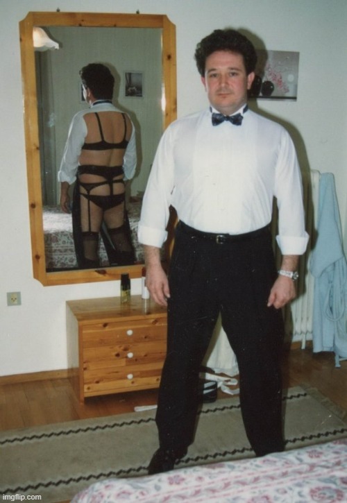 kinky man in business suit in front of mirror | image tagged in kinky man in business suit in front of mirror | made w/ Imgflip meme maker