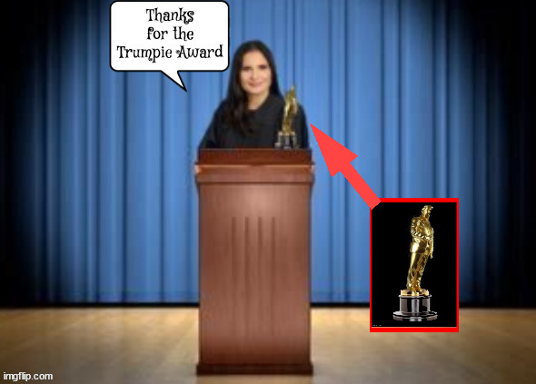 Cannon awarded Trumpie | image tagged in aileen cannon,maga judge,scotus or bust,mar-a-lago mistress,bad actor,monkey puppet | made w/ Imgflip meme maker