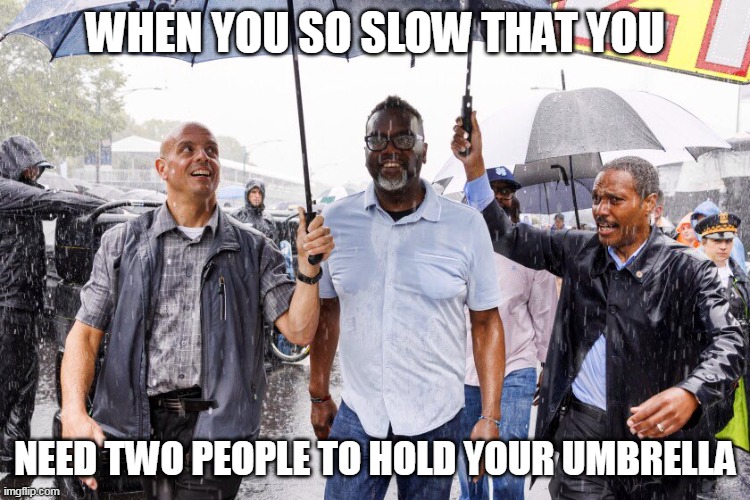 when you so slow that you | WHEN YOU SO SLOW THAT YOU; NEED TWO PEOPLE TO HOLD YOUR UMBRELLA | image tagged in brandon johnson,umbrella,politics,chicago,mayor | made w/ Imgflip meme maker