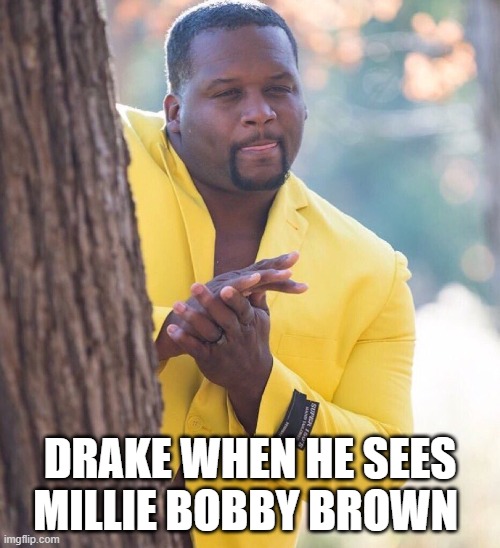 Black guy hiding behind tree | DRAKE WHEN HE SEES MILLIE BOBBY BROWN | image tagged in black guy hiding behind tree | made w/ Imgflip meme maker