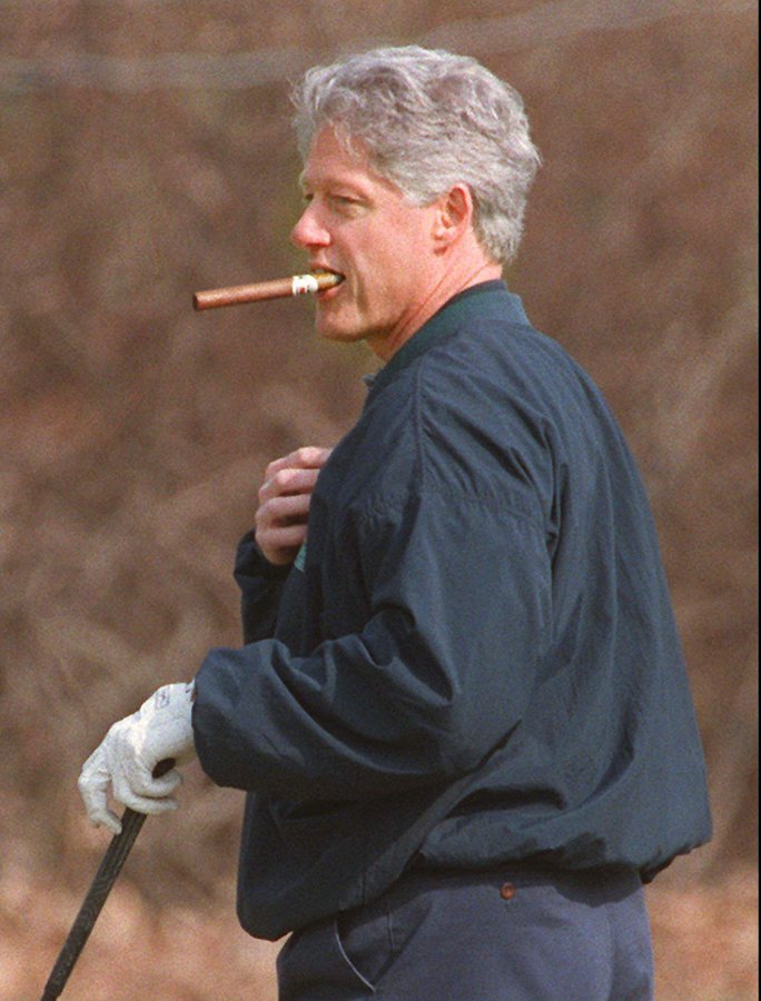 High Quality Bill Clinton smoking a cigar while playing golf Blank Meme Template