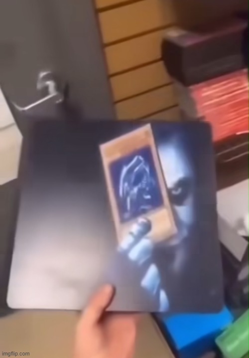 Joker holding the Blue Eyes White Dragon card | image tagged in joker holding the blue eyes white dragon card | made w/ Imgflip meme maker