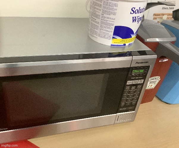 the microwave says “child” on the screen. | made w/ Imgflip meme maker