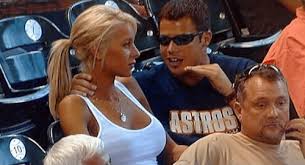 Annoying excited man tries to impress blonde girl at sports game Blank Meme Template